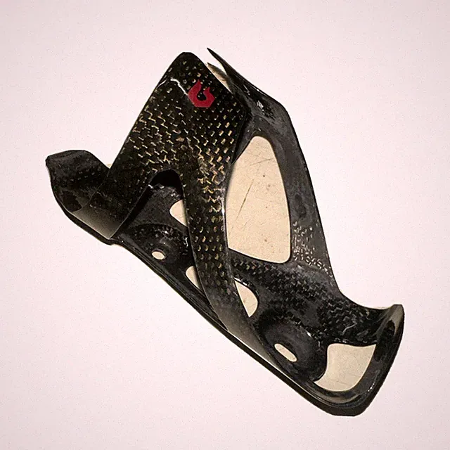 Black Blackburn Camber carbon fiber water bottle cage road bike light gravel mtb